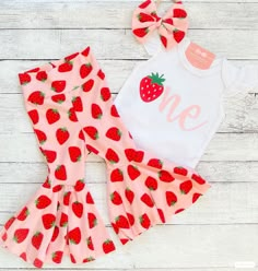 "You may choose: ~Darling strawberry \"One\" bodysuit as shown. Personalization optional. ~Adorable strawberry themed flare bell bottoms! Handmade here in our studio. ~Matching fabric bow/headband MATCHING FAMILY SHIRTS SOLD SEPARATELY. PLEASE USE LINK BELOW. https://www.etsy.com/listing/1420442525/strawberry-one-birthday-shirt-sweet-one?click_key=d7d549e7425fa50e0292170addad60f1452bf314%3A1420442525&click_sum=c567f7e3&ref=shop_home_active_4&pro=1&sts=1 Christi Creations - creating happy moments Berry First Birthday Outfit Parents, 1st Birthday Party Strawberry Theme, Berry First Birthday Party Outfit, Strawberry First Birthday Outfit, Sweet One Birthday Theme Strawberry, Babygirl 1 Birthday Theme, Strawberry First Birthday Party, 1st Birthday Girl Strawberry Theme, One Berry Sweet Girl Birthday