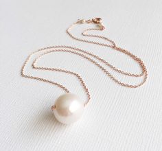 White pearl necklace floating pearl necklace by MaimodaJewelry Rose Gold Pearl Necklace With Charm For Wedding, Delicate Rose Gold Pearl Necklace For Formal Occasions, Rose Gold Pearl Drop Necklace For Wedding, Rose Gold Single Strand Pearl Necklace, Rose Gold Pearl Chain Necklace For Wedding, Delicate Rose Gold Pearl Necklace For Wedding, Classic White Necklace For Bridesmaid Gift, Formal Rose Gold Pearl Drop Necklace, Minimalist Rose Gold Pearl Chain Necklace