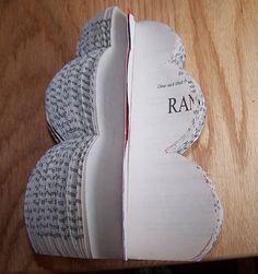 an open book sitting on top of a wooden table