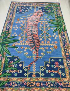 a blue rug with a tiger on it