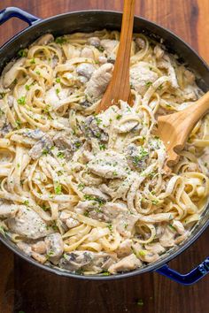 a skillet filled with chicken and noodles