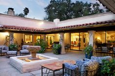 an outdoor living room and patio area with furniture