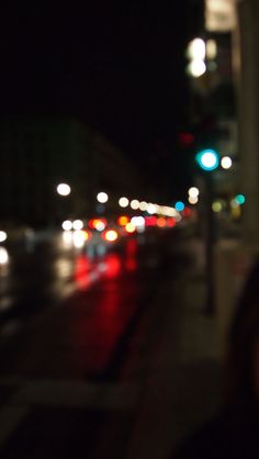 blurry photograph of city street at night