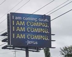 a large blue sign that says i am coming soon, i am coming jesus on it