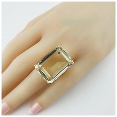 This stunning ring features one emerald cut smoky quartz (25 mm x 18 mm) set in classic 18K yellow gold.    Shank: 3 mm.  Total quartz weight:  37.18 ct.  Size: 9  Weight:  8.2 dwt. /  12.7 gr.  Stamped:  18K  Very good condition, professionally polished.  Will come packaged in a gift box or pouch (when possible) and will be shipped U.S. Priority Mail Insured.  GAI Certificate included. Modern Gold Topaz Ring In Rectangular Shape, Modern Gold Rectangular Topaz Ring, Elegant Gold Square Cut Topaz Ring, Elegant Gold Topaz Ring With Square Cut, Gold Emerald Ring With Rectangular Stone For Formal Occasions, Formal Gold Faceted Emerald Ring, Elegant Gold Rectangular Topaz Ring, Luxury Gold Rectangular Topaz Ring, Elegant Gold Rectangular Emerald Ring