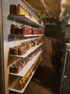 several shelves filled with jars and spices