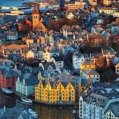 an aerial view of some buildings and water