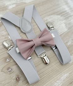 Your special guy will look so handsome when he shows up in his Dusty Mauve bow tie  and Light Gray suspenders!  Great set for groomsman, best man or ring bearers - This bow tie & suspenders set is a great choice for family photos, wedding, ring bearer outfit, birthday celebration or any other special occasion.  When making a purchase, you can choose from the following options : -Suspenders Only -Bow Tie Only. -Suspenders + Bow Tie Set. Attention ! We Will not accept any  returns based upon color Elegant Adjustable Belts And Suspenders For Wedding, Elegant Party Belt With Bow, Classic Wedding Belts And Suspenders With Bow Tie, Adjustable Bow Tie Back Belt For Wedding, Adjustable Wedding Belt With Bow Tie Back, Adjustable Ribbon Bow Tie For Wedding, Adjustable Dapper Bow For Wedding, Adjustable Dapper Wedding Bow, Gray Braces