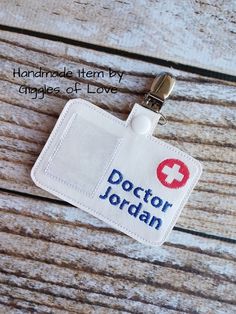 an id badge with the name doctor jordan printed on it, attached to a key chain