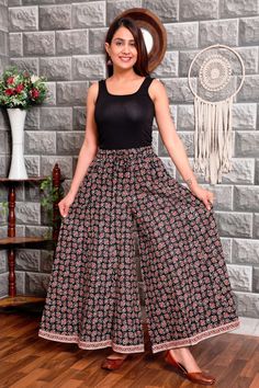 "Smart ethnic cotton printed palazzo/ Indian pant/ Floral print/ Flared pant Stitched with 12 parts neatly with full interlock.  Very comfortable 100 % soft cotton for wearing in summers. stylish border waist band. comfortable fitting. White printing is specialty of hand printing work. 100 % Indian product. Cotton fabric keeps you cool. Can wear with smart top. Measurements -  Closure-  Full elasticated band with same fabric drawstring. Length -   38 \" (standard) Waist    -   28\",30\",32\",34\ Cotton Floral Print Sharara For Navratri, Traditional Cotton Maxi Palazzo Set, Traditional Cotton Palazzo Set Maxi Length, Multicolor Floral Print Cotton Wide Leg Pants, Multicolor Cotton Wide Leg Pants With Floral Print, Cotton Palazzo Set With Printed Border For Festivals, Traditional Cotton Wide Leg Sets, Traditional Cotton Sets With Wide Leg, Bohemian Wide Leg Floral Print Cotton Pants