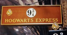 the hogwart's express sign is hanging from the side of a building