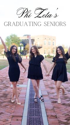 three girls in black dresses are posing for the camera with their arms up and one girl is