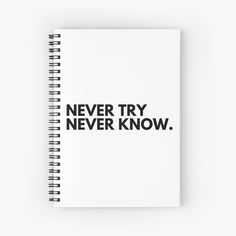 a spiral notebook with the words never try, never know written in black on it