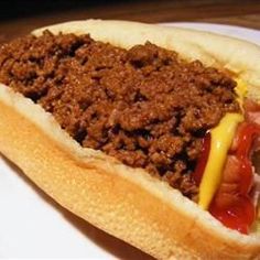 a chili cheese dog with mustard and ketchup