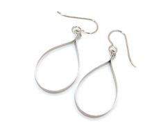 "These open teardrop hoop earrings are made from pure grade 1 titanium.  They are 1/8\" strips cut from titanium sheet then shaped and tumbled for a smooth satin finish. These earrings are completely nickel free and hypoallergenic, making them comfortable for anyone to wear. * Pure titanium  * Niobium ear wire option (drop down menu) * Earring drop length 1 1/2\", width 11/16\" * Lightweight * Nickel free  Pure titanium is considered the most hypoallergenic of all metals. It is commonly used in surgical implants because it is non-reactive and bio-compatible. It will not rust, corrode, or tarnish over time. It is also very strong, durable, and extremely lightweight. Pure titanium is a great option for anyone with sensitive ears or metal allergies. Niobium ear wires are a softer metal than t Modern Hypoallergenic Teardrop Jewelry, Modern Teardrop Stainless Steel Earrings, Nickel-free Modern Teardrop Earrings For Gift, Everyday Nickel-free Teardrop Metal Earrings, Modern Nickel-free Teardrop Earrings For Gift, Minimalist Hypoallergenic Metal Teardrop Earrings, Modern Nickel-free Teardrop Earrings, Everyday Nickel Free Teardrop Earrings, Hypoallergenic Metal Teardrop Earrings For Everyday