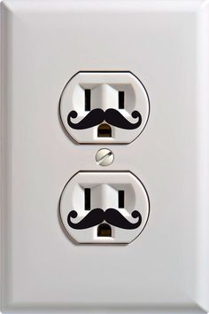 two light switches with mustaches painted on them