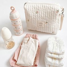 baby items laid out on a white surface