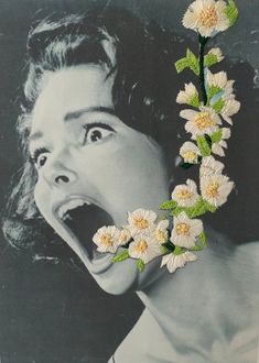 a woman with her mouth open and flowers in front of her face on a black and white photo