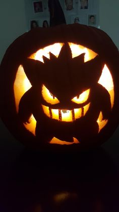 a carved pumpkin with an evil face on it