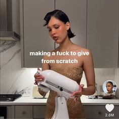 a woman holding a hair dryer in her hands