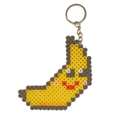 a keychain with a pixellated image of a yellow bird on it's face