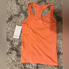 Brand New!! Never Worn And Still Has The Tag! It’s A Swiftly Tech Racerback 2.0 Color Orange Swiftly Tech, Lululemon Tank Top, Lululemon Tops, Green Tank Top, Workout Tank Top, Green Tank, Lululemon Tank, Pink Tank, Pink Tank Top