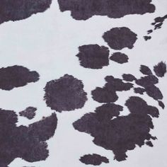 black and white animal print on fabric with spots in the middle, as seen from above