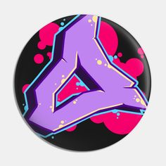 a button with the letter a in purple and pink paint splattered on it