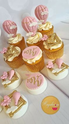 pink and gold cupcakes with hot air balloons