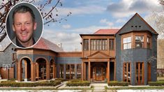 a large house with a mans face in the front yard and an image of a man's head