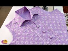 a purple shirt sitting on top of a table