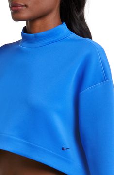 An oversized mock-neck sweatshirt features moisture-wicking Dri-FIT techology that keeps you comfy, while a cropped length creates a cool, modern look. 15 1/2" front length; 18" back length (size Medium) Mock neck 93% polyester, 7% spandex Machine wash, tumble dry Imported Versatile Funnel Neck Top With Ribbed Cuffs, Athleisure High Neck Tops With Ribbed Cuffs, Athleisure Turtleneck Top With Ribbed Cuffs, Nike Workout Tops With Ribbed Cuffs, Sporty Turtleneck Sweatshirt With Ribbed Collar, Sporty Funnel Neck Top With Ribbed Cuffs, Sporty Top With Funnel Neck And Ribbed Cuffs, Sporty Tops With Funnel Neck And Ribbed Cuffs, Sports Funnel Neck Top With Ribbed Cuffs