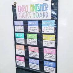 a bulletin board with words on it and some magnets attached to the back wall