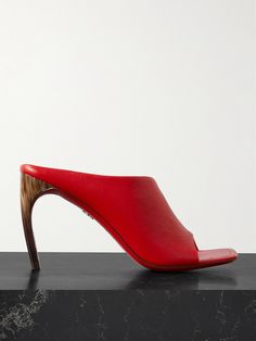 From the bold 'Flame Red' shade to the innovative design, Ferragamo's 'Nymphe' mules certainly command attention. They've been made in Italy from leather and have wide asymmetric straps and square toes. The curved, wooden heels enhance the sculptural effect. Wooden Heels, Eyewear Shop, Sport Swimwear, Ferragamo Shoes, Wooden Heel, Fine Watches, Leather Mules, Innovative Design, Mid Heel