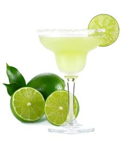 a margarita cocktail with limes on the side and a slice of lime next to it