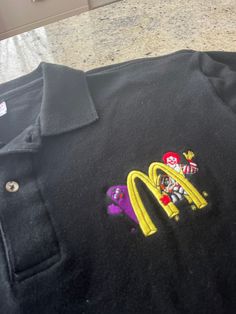 Vintage McDonalds Grimace Ronald HamBurglar Polo Shirt  Size Medium.  See pics for measurements  Awesome Graphic of the McDonalds characters  Grimace Milk Shake  Quality Embroidered graphic with the Golden Arches  80s 90s 00s  Rare survivor.  You will be the only one with this one ! Excellent condition.  Appears to have been worn very little if at all  Quick shipping.  We ship same or next day with USPS mail  We are a small family business and we appreciate your purchase, Godspeed ! Mcdonalds Characters, Mcdonalds Grimace, Vintage Mcdonalds, Milk Shake, 90s 00s, Small Family, Family Business, Ronald Mcdonald, Track Pants