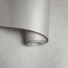 a roll of silver colored paper sitting on top of a table