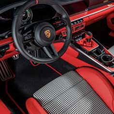 the interior of a red sports car