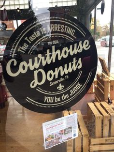 there is a sign that says courthouse donuts you'll be the judge