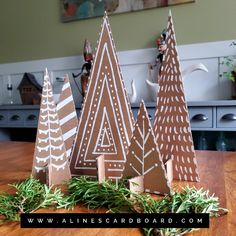 some brown and white christmas trees on a table