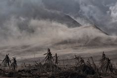 the clouds are blowing over the mountains in the foggy weather, and there is no image here to provide a caption for