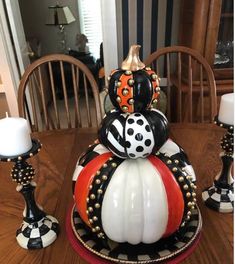 a decorative pumpkin sitting on top of a plate