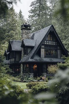 a house in the woods with trees around it