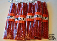 six red candy sticks wrapped in plastic wrappers with the words that hit on them