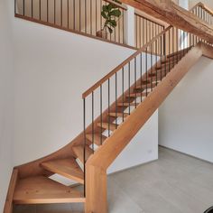 there is a wooden stair case in the house