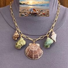 Get Boho Beach Vibes All Year Long, With This Cute Handmade Seashell Necklace! This Statement Piece Features Real Seashell Pendants Dangling From A 14k Gold-Plated Paper Clip Chain. In The Center Is A Peachy-Brown Fan Seashell Pendant. On Each Side Of The Fan Seashell Pendant Is A Green And Brown Speckled Spiral Seashell Pendant. On The Right Side Is A Smaller Brown Conch Seashell Pendant. On The Left Side Is A Smaller White Spiral Seashell Pendant. All Seashell Pendants Are Dipped In Gold. This Multicolor Shell-shaped Jewelry For Beach, Multicolor Shell Jewelry For Vacation, Multicolor Strand Shell Necklace For Beach, Shell Necklace For Beach Vacation, Vacation Shell Necklace For Beach Season, Multicolor Shell-shaped Necklaces For Beach, Multicolor Shell-shaped Necklace For Beach, Multicolor Shell Necklace For Vacation, Multicolor Shell Necklace For Beach