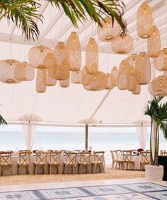 a large blue and white area rug under a tent with tables set up on it