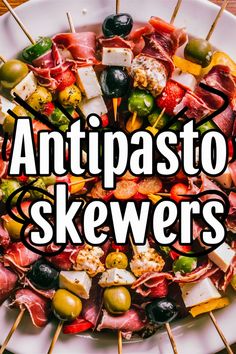 Antipasto skewers with assorted meats, cheeses, and olives. Tomato Salami Skewers, Tortellini Skewers With Pesto, Halloween Antipasto Skewers, Salami And Mozzarella Appetizer, Italian Appetizers Easy Appetizer Ideas Antipasto Skewers, Tortellini Squewers, Mozzarella Skewers Appetizer Ideas, Easy Antipasto Platter, Antipasto Skewers Appetizers