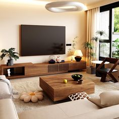 a living room filled with furniture and a flat screen tv mounted to the side of a wall