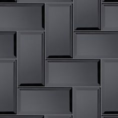 a wall made up of square and rectangles in dark grey color with black background